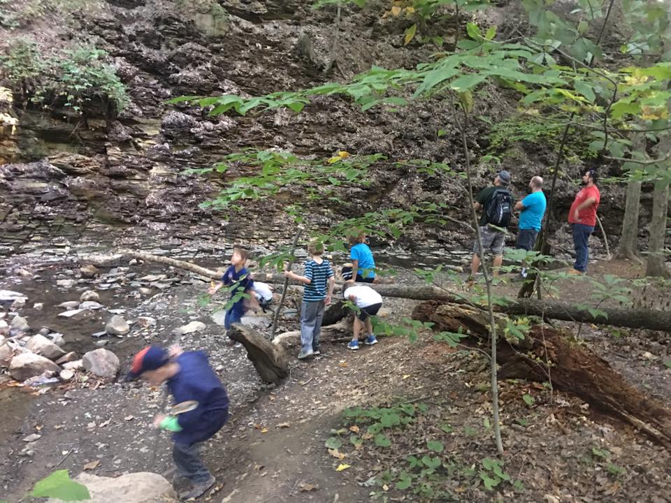 Group of people walking in a rocky park Group of people walking in a rocky park